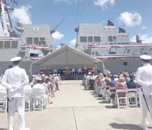Admiral Harry Harris Jr., Commander of U.S. Pacific Command, delivers the keynote address at the commissioning of the USS John Finn in Hawaii. 