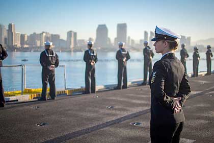 SAN DIEGO (Jan. 5, 2018) Chief Aviation Ordnanceman Natasha Swartley supervises Sailors as they man the rails aboard Nimitz-class aircraft carrier USS Carl Vinson (CVN 70) before it departs San Diego. The Carl Vinson Strike Group is currently operating in the Pacific as part of a regularly scheduled deployment. U.S. Navy Photo by MC3 Matthew Granito