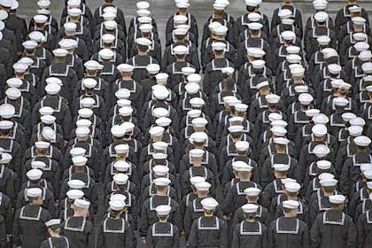 SAN DIEGO (Jan. 20, 2020) Sailors muster to man the rails aboard the aircraft carrier USS Abraham Lincoln (CVN 72) as it arrives at Naval Air Station North Island after a ten-month deployment in support of maritime security operations and theater security cooperation efforts in the U.S. 6th, 5th, and 7th Fleet areas of operation. With Abraham Lincoln as the flagship, deployed strike assets include staffs and aircraft of Carrier Strike Group (CSG) 12, Destroyer Squadron (DESRON) 2 and Carrier Air Wing (CVW) 7. U.S. Navy photo by MC3 Darion Chanelle Triplett.