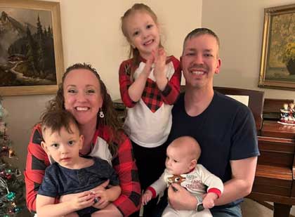 Army Staff Sgt. Kent Redmond and wife Tara celebrate Christmas with their children, (from left, John Terry, Lucille Jane and George Henry in Minneapolis in 2022 The Defense Department has issued new policies for paid, non-chargeable parental leave for service members who have a child through birth, adoption or a long-term foster care placement 24 months. 