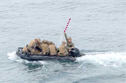 Marines assigned to a Maritime Raid Force (MRF) platoon, 13th Marine Expeditionary Unit (MEU), depart amphibious transport dock USS Anchorage (LPD 23) on a combat rubber raiding craft (CRRC), June 4, 2023 off the coast of Camp Pendleton. Synchronizing the complementary capabilities of the 13th MEU and Anchorage multiplies the traditional influence of sea power to produce a more competitive and lethal force. The Makin Island Amphibious Ready Group, comprised of amphibious assault ship USS Makin Island (LHD 8) and amphibious transport docks Anchorage and USS John P. Murtha (LPD 26), is underway conducting routine operations in the U.S. 3rd Fleet with the 13th MEU. (U.S. Navy photo by Mass Communication Specialist 1st Class Tom Tonthat