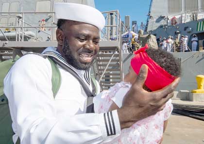 SAN DIEGO (Aug. 28, 2023) Boatswain's Mate 3rd Class Elvis Osemwengie meets his daughter from the pier of the Arleigh Burke-class guided-missile destroyer USS Paul Hamilton (DDG 60) in San Diego, Aug. 28, 2023. Paul Hamilton returned to homeport following a seven-month deployment in U.S. 5th Fleet area of operations. U.S. Navy photo by MC3 Elliot Schaudt