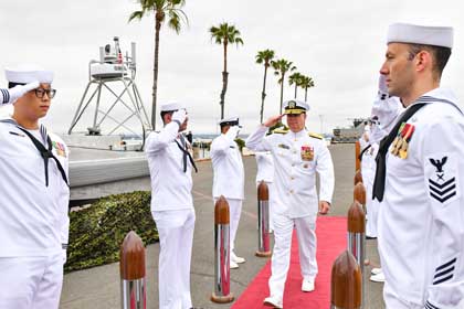 NAVAL BASE CORONADO (May 17, 2024) - Commander, Naval Surface Force, U.S. Pacific Fleet Vice Adm. Brendan McLane is rung in upon his arrival to the establishment ceremony for Unmanned Surface Vessel Squadron 3 (USVRON 3) on Naval Amphibious Base Coronado May 17, 2024. The squadron is comprised of unmanned Global Autonomous Reconnaissance Crafts (GARCs). The 16-foot GARCs built by Maritime Applied Physics Corporation enable research, testing, and operations that will allow integration throughout the surface, expeditionary, and joint maritime forces. U.S. Navy photo by MC1 Claire M. DuBois.
