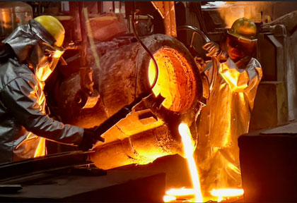 Foundry artisans fill a mold to manufacture cast parts at Stainless Foundry and Engineering in Wisconsin, March 31, 1011. Casting work is important to the DOD, particularly to the Navy. Developing a workforce capable of the skills needed for casting and forging is something the Defense Department is working on as a way to strengthen the defense industrial base. Photo credit: Nutan Chada, Defense Logistics Agency.